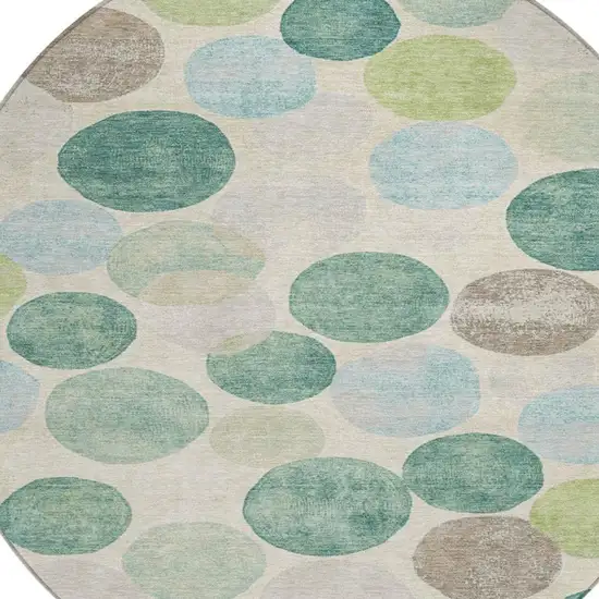 8' Teal Blue Green And Ivory Round Geometric Washable Indoor Outdoor Area Rug Photo 9
