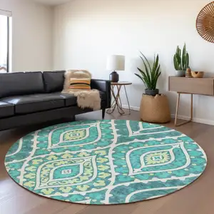 Photo of 8' Teal Blue Ivory And Artichoke Green Round Floral Washable Indoor Outdoor Area Rug