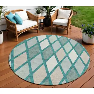 Photo of 8' Teal Blue Ivory And Beige Round Geometric Washable Indoor Outdoor Area Rug