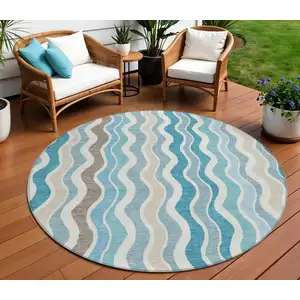 Photo of 8' Teal Blue Ivory And Beige Round Striped Washable Indoor Outdoor Area Rug