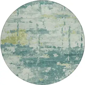 Photo of 8' Teal Blue Ivory And Gold Round Abstract Washable Indoor Outdoor Area Rug