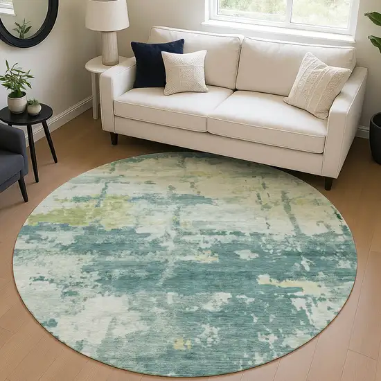 8' Teal Blue Ivory And Gold Round Abstract Washable Indoor Outdoor Area Rug Photo 5
