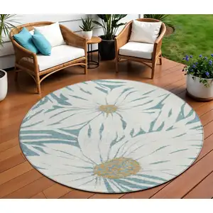 Photo of 8' Teal Blue Ivory And Gold Round Floral Washable Indoor Outdoor Area Rug