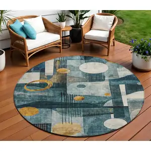 Photo of 8' Teal Blue Ivory And Gold Round Geometric Washable Indoor Outdoor Area Rug