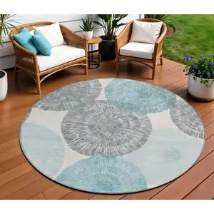 Photo of 8' Teal Blue Ivory And Gray Round Abstract Washable Indoor Outdoor Area Rug