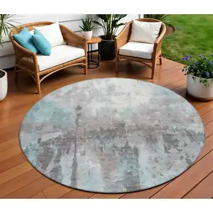 Photo of 8' Teal Blue Ivory And Gray Round Abstract Washable Indoor Outdoor Area Rug