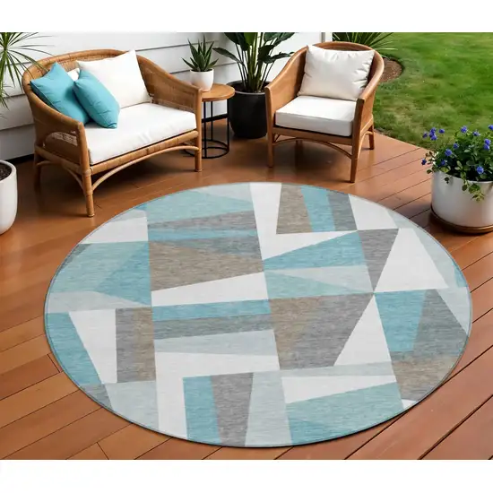 8' Teal Blue Ivory And Gray Round Geometric Washable Indoor Outdoor Area Rug Photo 1