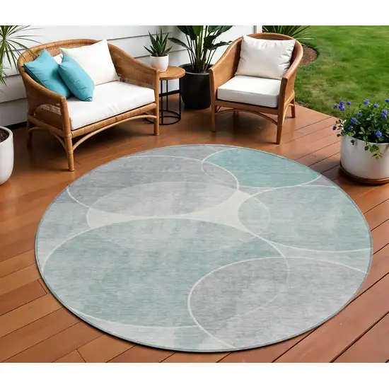 8' Teal Blue Ivory And Gray Round Geometric Washable Indoor Outdoor Area Rug Photo 1