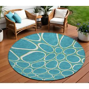Photo of 8' Teal Blue Ivory And Green Round Abstract Washable Indoor Outdoor Area Rug