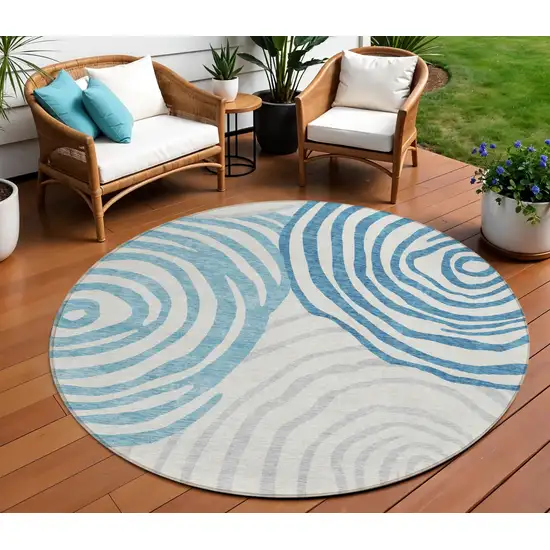 8' Teal Blue Ivory And Silver Round Abstract Washable Indoor Outdoor Area Rug Photo 1