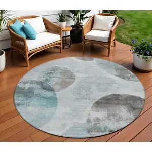Photo of 8' Teal Blue Ivory And Taupe Round Abstract Washable Indoor Outdoor Area Rug