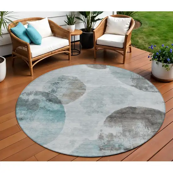 8' Teal Blue Ivory And Taupe Round Abstract Washable Indoor Outdoor Area Rug Photo 1