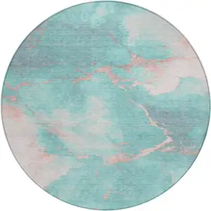 Photo of 8' Teal Blue Peach And Ivory Round Abstract Washable Indoor Outdoor Area Rug