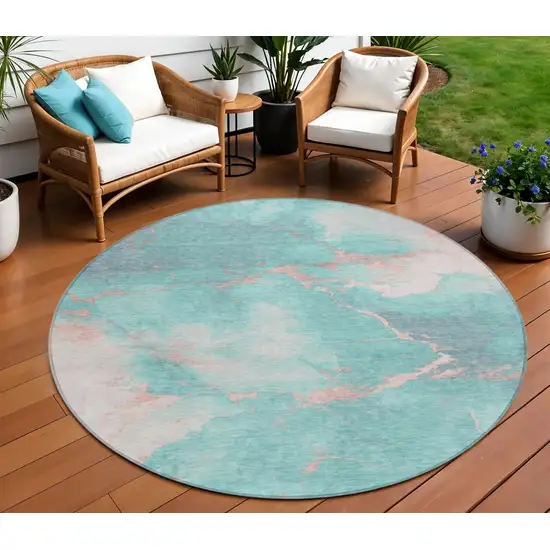 8' Teal Blue Peach And Ivory Round Abstract Washable Indoor Outdoor Area Rug Photo 2