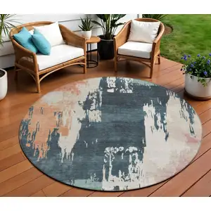 Photo of 8' Teal Blue Pink And Orange Round Abstract Washable Indoor Outdoor Area Rug