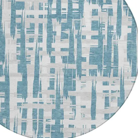 8' Teal Blue Silver And Ivory Round Striped Washable Indoor Outdoor Area Rug Photo 4