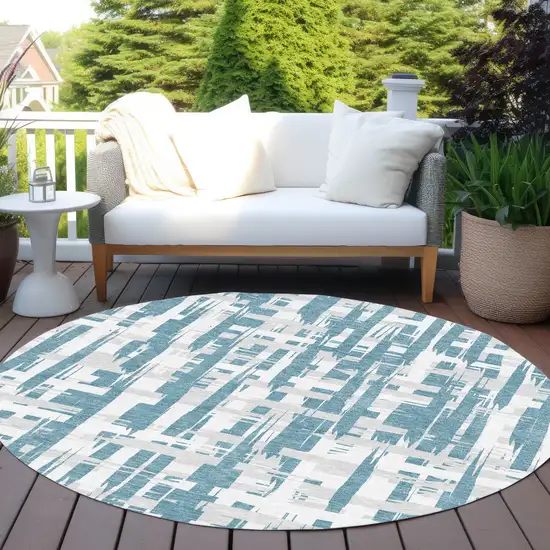 8' Teal Blue Silver And Ivory Round Striped Washable Indoor Outdoor Area Rug Photo 5
