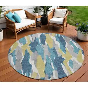 Photo of 8' Teal Blue Yellow And Ivory Round Striped Washable Indoor Outdoor Area Rug