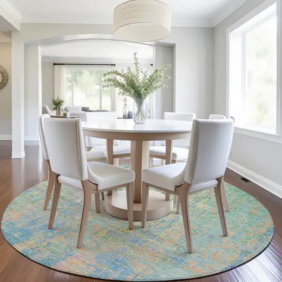 8' Teal Blue Yellow And Orange Round Abstract Washable Indoor Outdoor Area Rug Photo 6