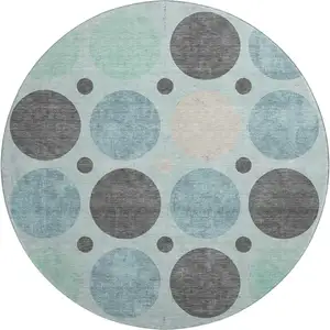 Photo of 8' Teal Charcoal And Beige Geometric Washable Round Rug With UV Protection