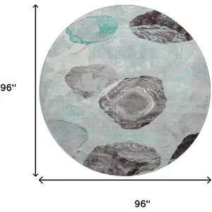 Photo of 8' Teal Charcoal And Ivory Geometric Washable Round Rug With UV Protection