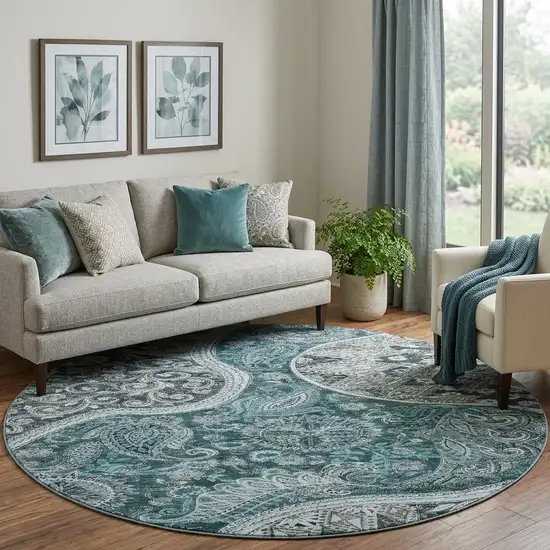 8' Teal Charcoal And Ivory Paisley Washable Round Rug With UV Protection Photo 1