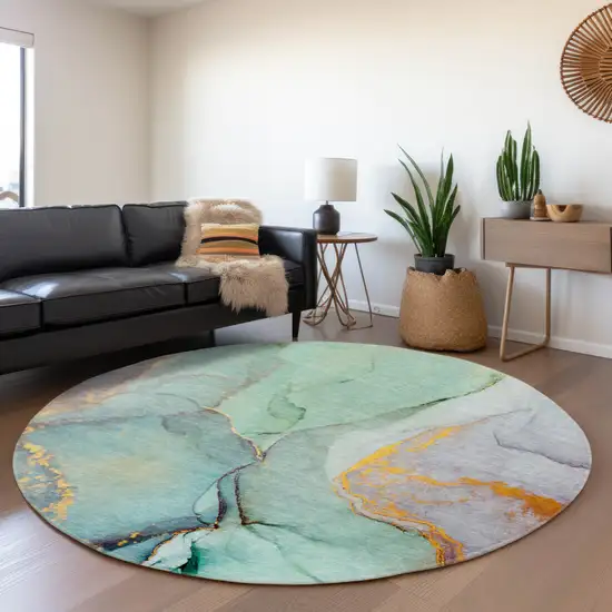 8' Teal Gold And Ivory Abstract Washable Round Rug With UV Protection Photo 5