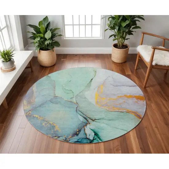 8' Teal Gold And Ivory Abstract Washable Round Rug With UV Protection Photo 2