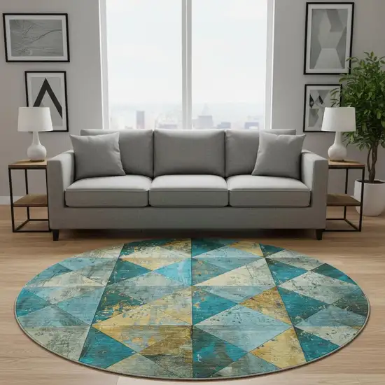 8' Teal Gold And Ivory Geometric Washable Round Rug With UV Protection Photo 2