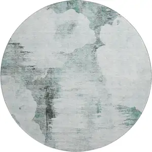 Photo of 8' Teal Gray And Ivory Abstract Washable Round Rug With UV Protection