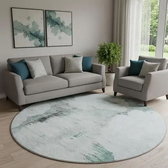 8' Teal Gray And Ivory Abstract Washable Round Rug With UV Protection Photo 1