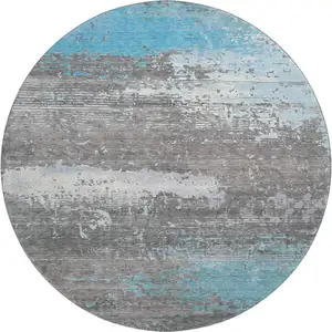 Photo of 8' Teal Gray And Ivory Abstract Washable Round Rug With UV Protection