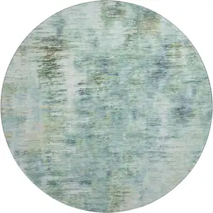 Photo of 8' Teal Green And Ivory Abstract Washable Round Rug With UV Protection