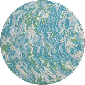 Photo of 8' Teal Green And Ivory Abstract Washable Round Rug With UV Protection