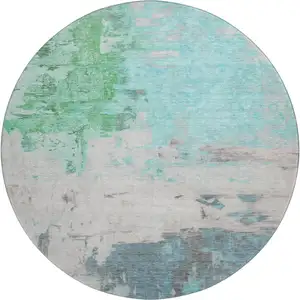 Photo of 8' Teal Green And Ivory Abstract Washable Round Rug With UV Protection