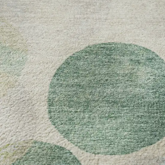 8' Teal Green And Ivory Geometric Washable Round Rug With UV Protection Photo 9