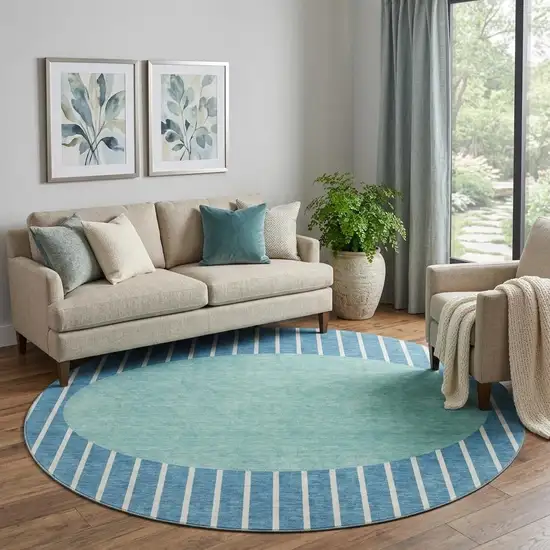 8' Teal Ivory And Aqua Striped Washable Round Rug With UV Protection Photo 1