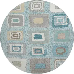 Photo of 8' Teal Ivory And Beige Geometric Washable Round Rug With UV Protection