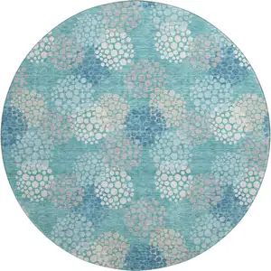 Photo of 8' Teal Ivory And Beige Polka Dot Washable Round Rug With UV Protection