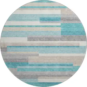 Photo of 8' Teal Ivory And Beige Striped Washable Round Rug With UV Protection
