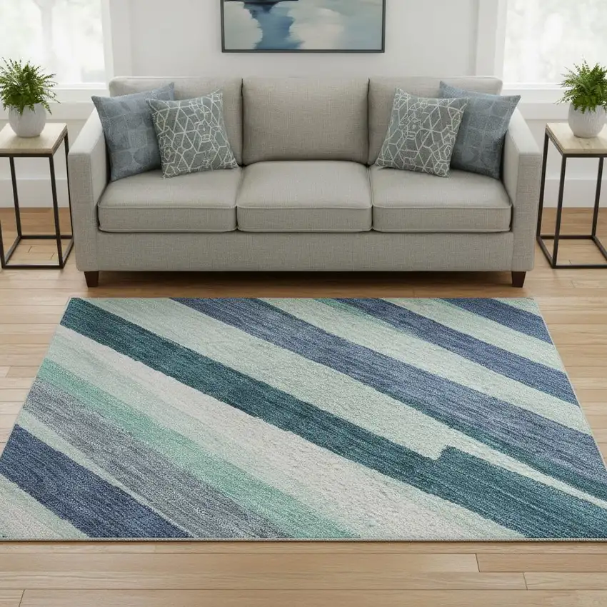 8' Teal Ivory And Blue Striped Washable Round Rug With UV Protection Photo 2