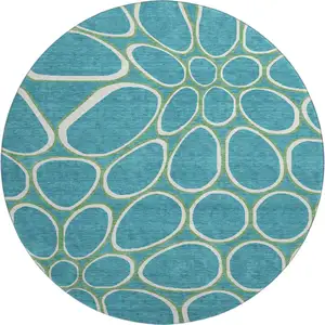 Photo of 8' Teal Ivory And Green Geometric Washable Round Rug With UV Protection