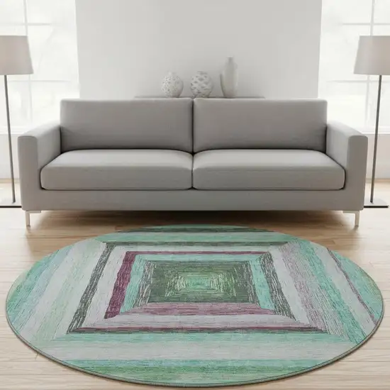 8' Teal Mauve And Ivory Geometric Washable Round Rug With UV Protection Photo 2