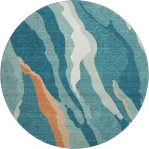 Photo of 8' Teal Orange And Ivory Abstract Washable Round Rug With UV Protection