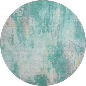 Photo of 8' Teal Peach And Ivory Abstract Washable Round Rug With UV Protection