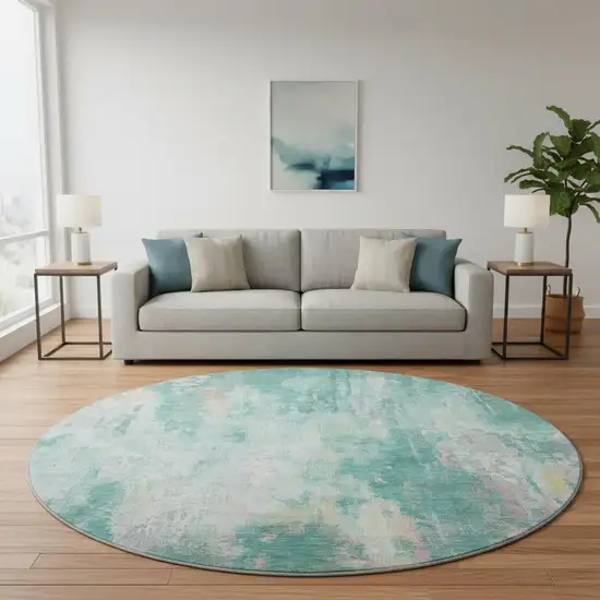 8' Teal Peach And Ivory Abstract Washable Round Rug With UV Protection Photo 2