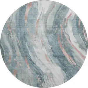 Photo of 8' Teal Peach And Ivory Abstract Washable Round Rug With UV Protection