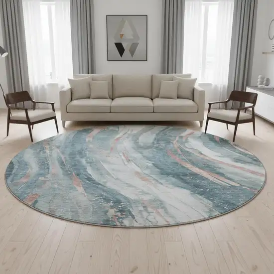 8' Teal Peach And Ivory Abstract Washable Round Rug With UV Protection Photo 2