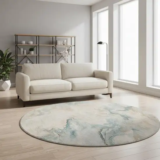 8' Teal Peach And Ivory Abstract Washable Round Rug With UV Protection Photo 2