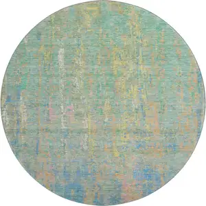Photo of 8' Teal Purple And Gold Abstract Washable Round Rug With UV Protection